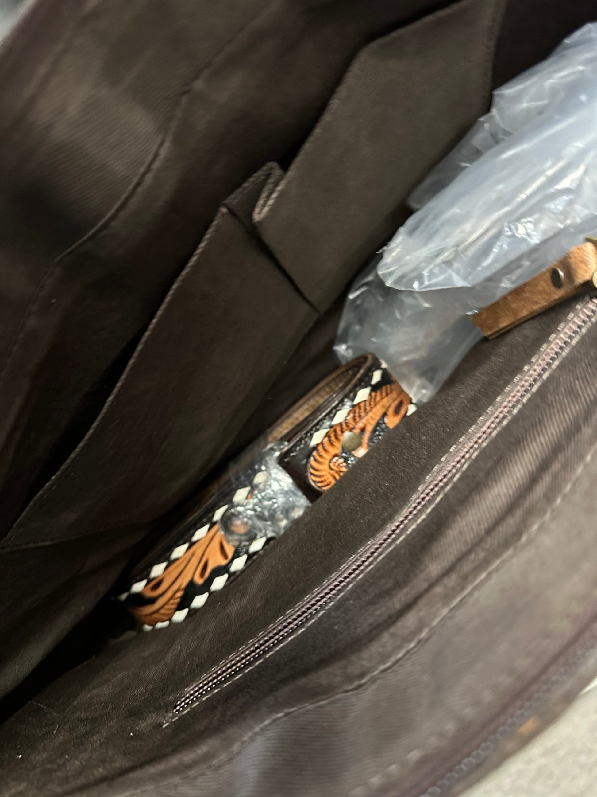 Tooled cowhide bag